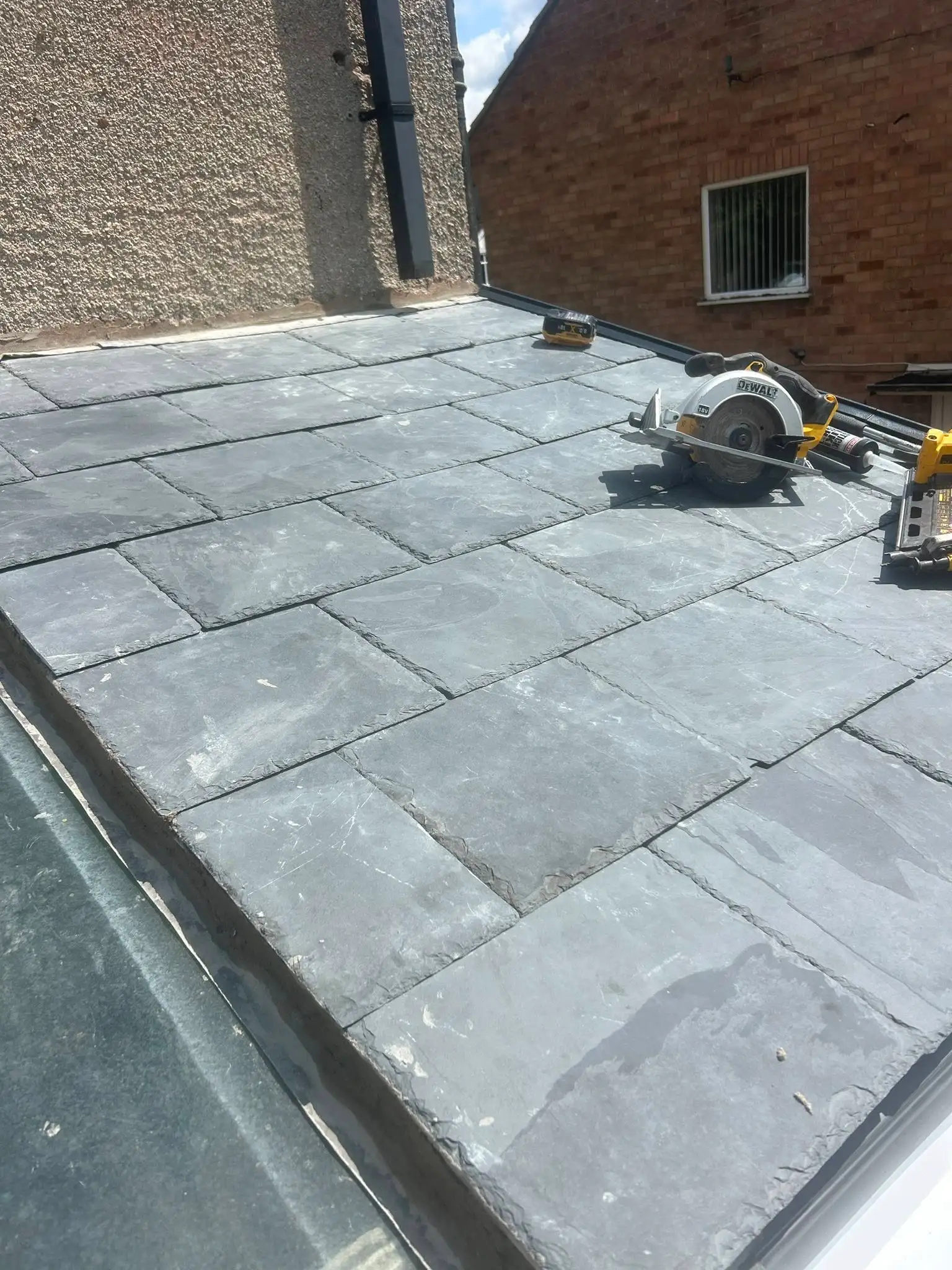 Finished fascia, soffit and guttering on a brick home