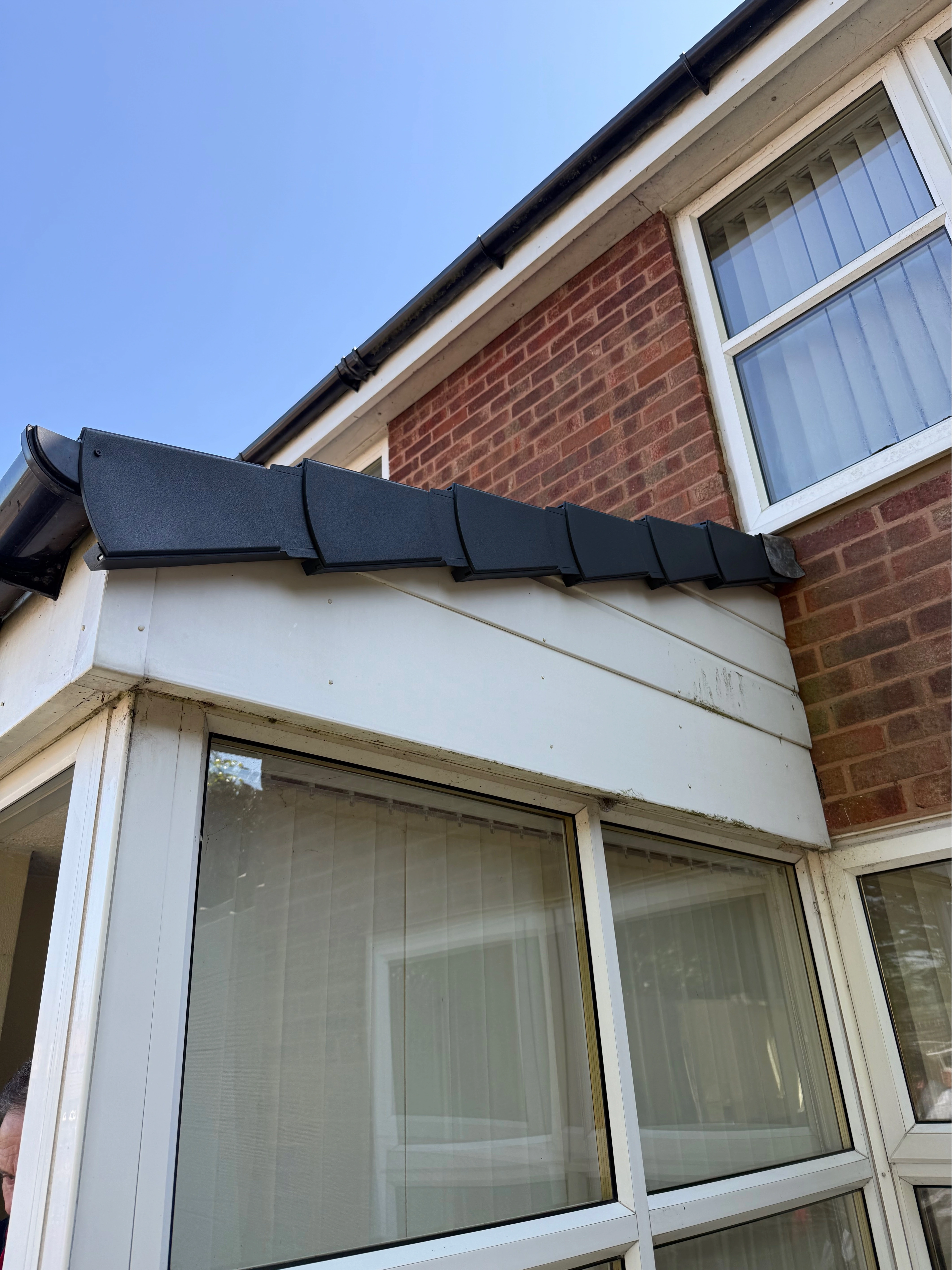 New tiled roof installation on a brick property